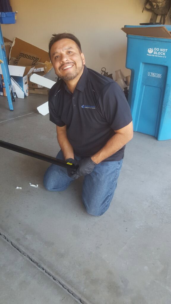 technician installing a new garage door opener in scottsdale, az