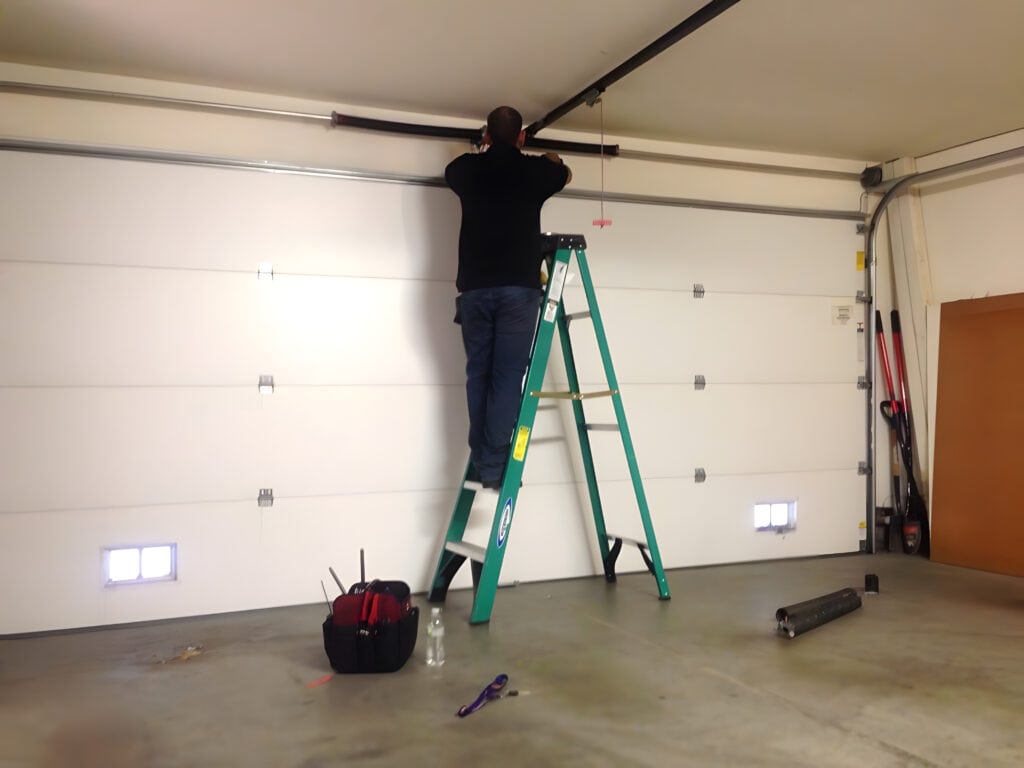 technician performing garage door repari at a home in McCormick Ranch in Scottsdale, AZ