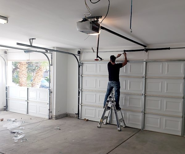 Off track garage door before repair, Old Town Scottsdale AZ