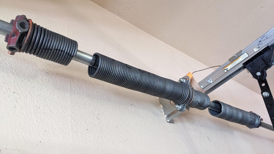 Broken garage door torsion springs before repair, Phoenix AZ