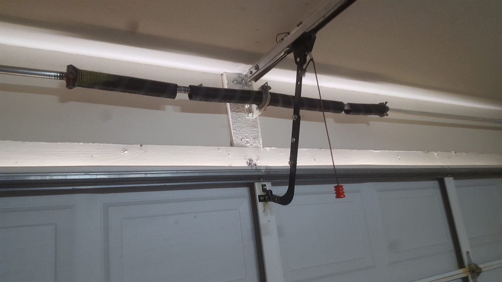 Two broken garage door torsion springs requiring replacement in Phoenix AZ