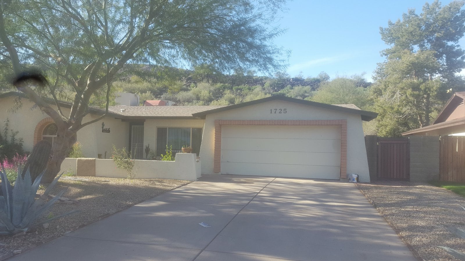 Newly installed white garage door on Phoenix AZ home