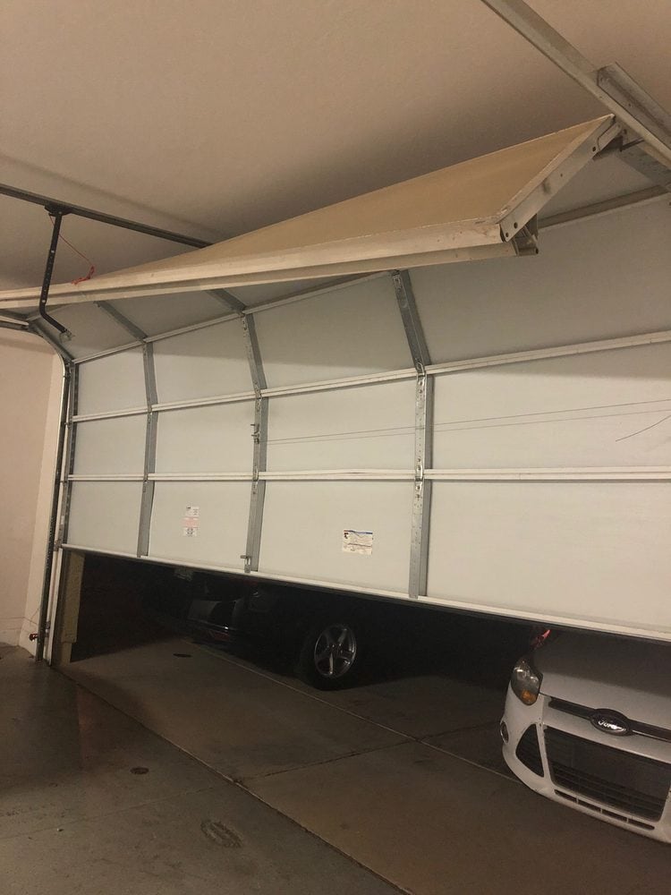Garage door off track before repair, Scottsdale AZ