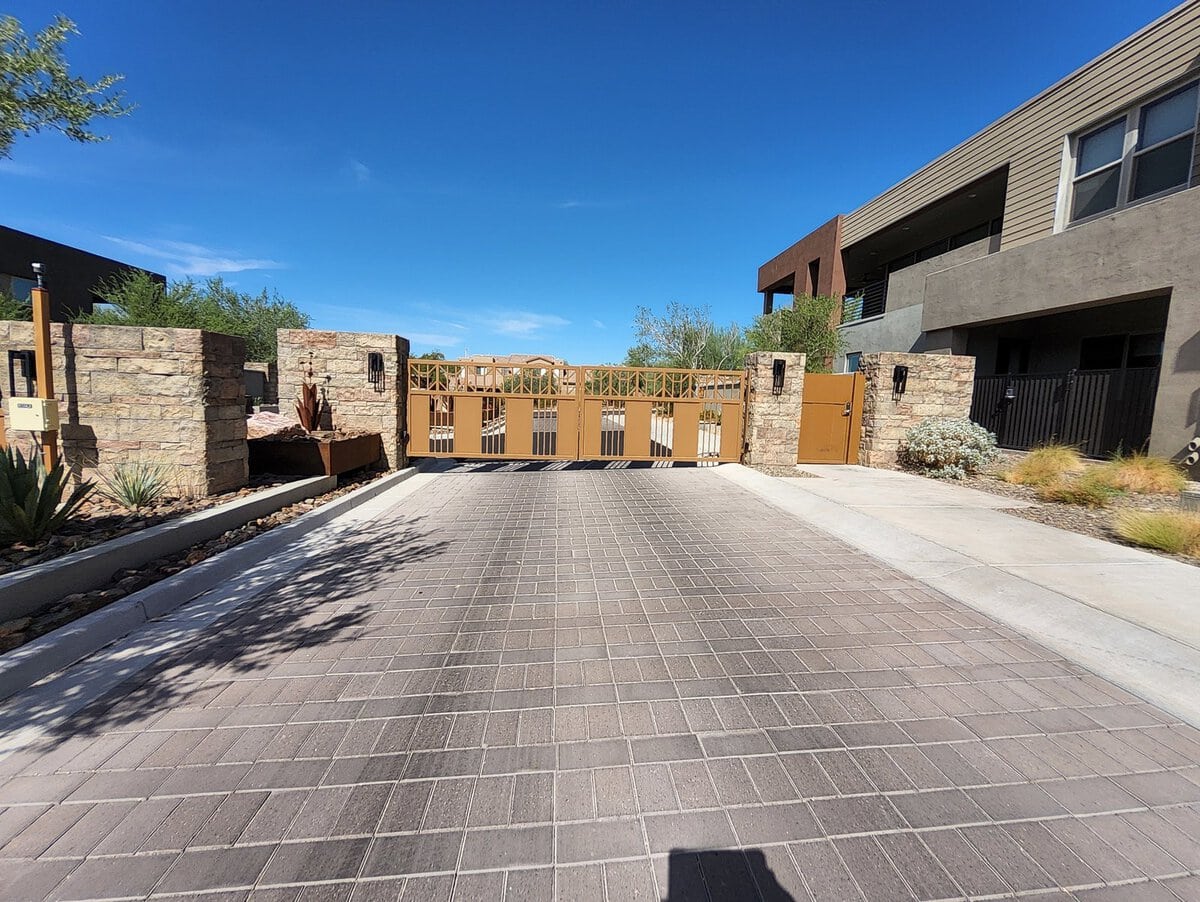 Luxury community automatic entry gate with stone pillars, Scottsdale AZ