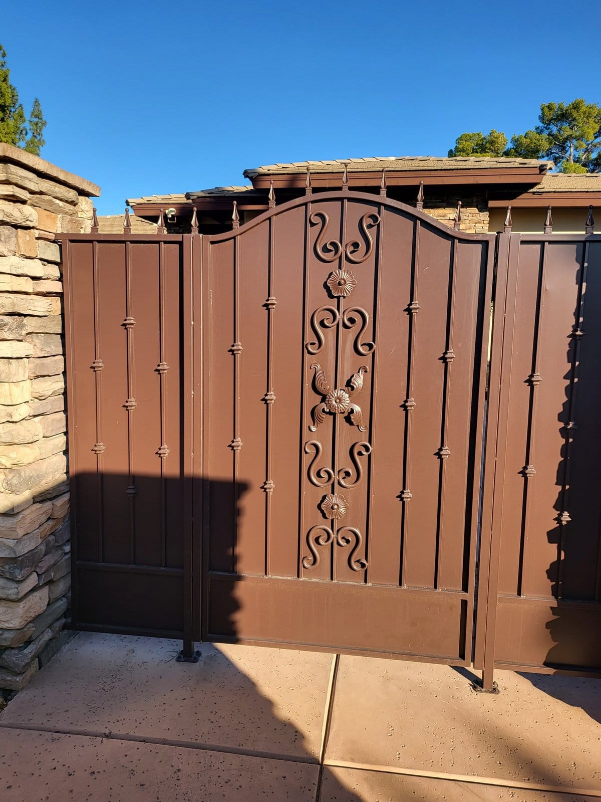 Ornate wrought iron automatic estate gate scrollwork detail, Scottsdale AZ