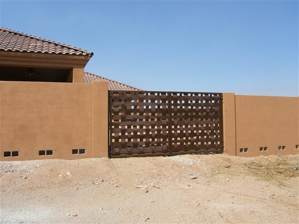 Woven metal driveway gate installation in Scottsdale AZ