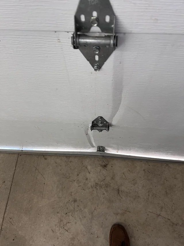 Dented garage door panel repair in Ahwatukee, Arizona