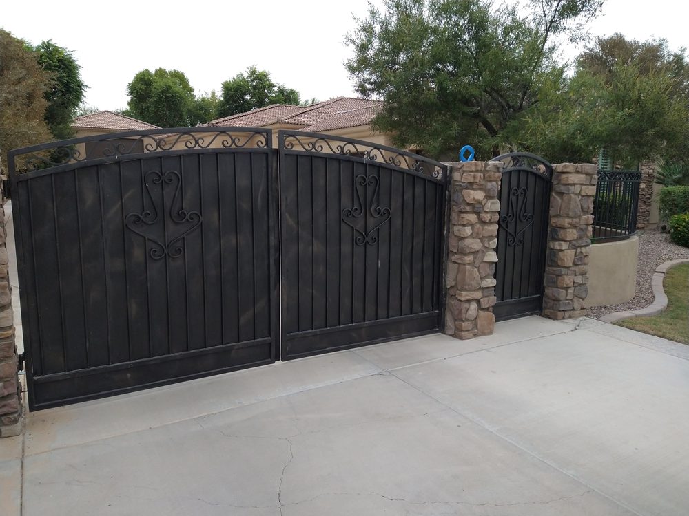 Black scroll double driveway gate repair in Phoenix, AZ