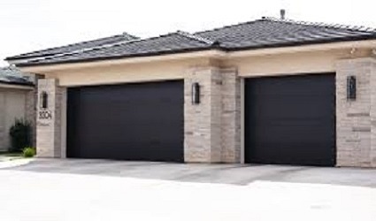 Custom 3-car wood-look garage door installation with mountain view in Phoenix AZ