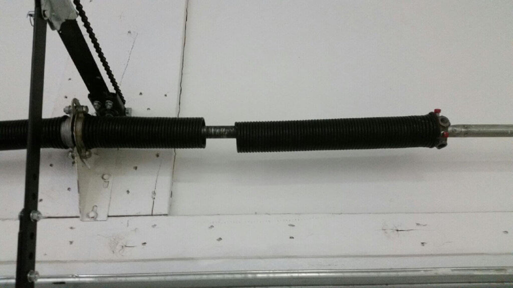 Broken garage door torsion spring requiring replacement in Scottsdale AZ