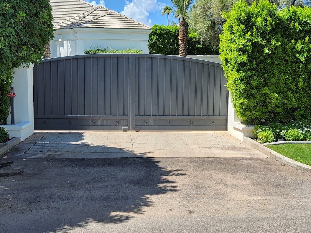 Custom arched dual swing driveway gate installed in Scottsdale AZ