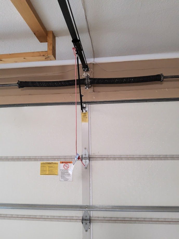 Broken torsion spring repair close-up Scottsdale AZ