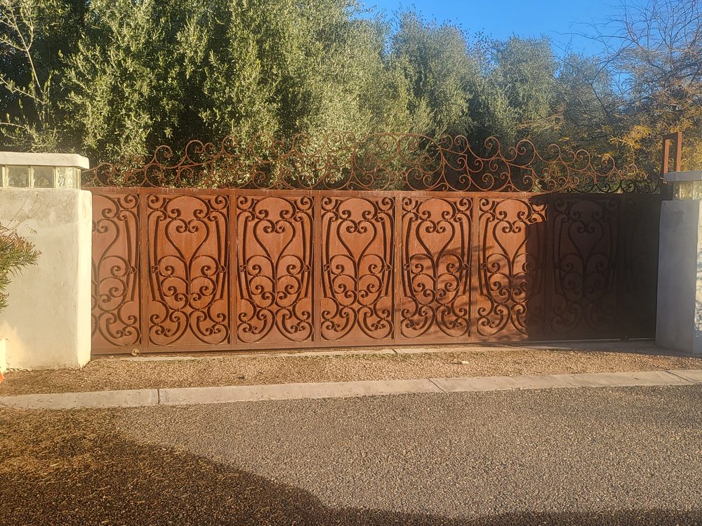 Ornate heart scroll rust driveway gate, Scottsdale AZ