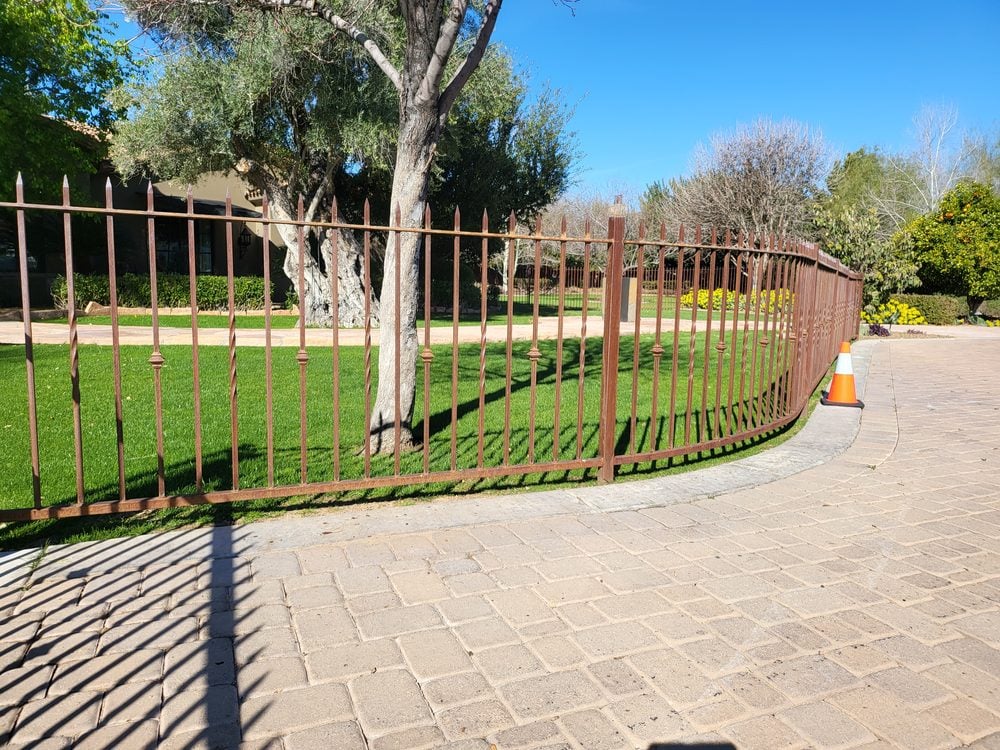 Twisted rail view fence overlooking desert road, Scottsdale AZ